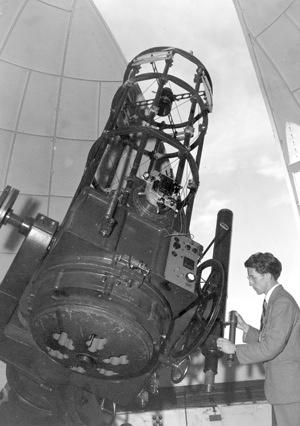 Walter Stibbs at telescope, 1950