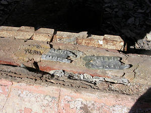 In several cases, lead flashing has melted and run onto brickwork, producing a negative moulding of the brick brand.