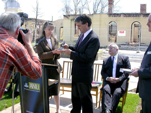 Penny Sackett presents John Anderson with a commemorative sculpture