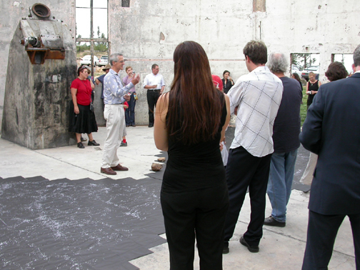 Mr Nigel Lendon, Deputy Director of the School of Art, explaining the art of the exhibition