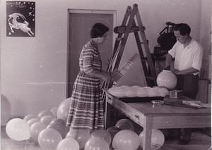 Artist Rosalie Gascoigne directs the decorations in the Conference Room