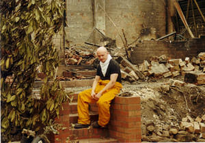 Andrew in front of the ruins of the shed 19-1-03