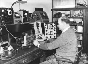 Don Thomas works with electronics, 1955