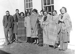 Staff trying to stay warm, 1950