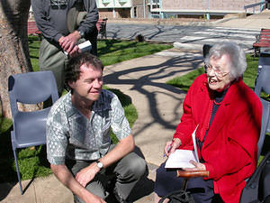 Miss Joan Duffield autographs a book for Mike Nelmes