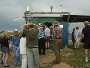 Roof closed before the rain starts, and members inspect the 'scope