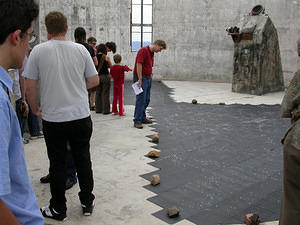 Inspection of the artwork by an RSAA PhD student