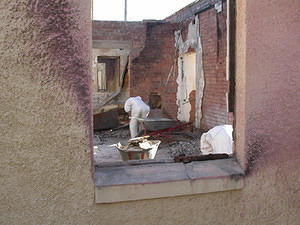 In each room, the ash and rubbish is checked for relics of use, the barrowed into individual piles, one per room.