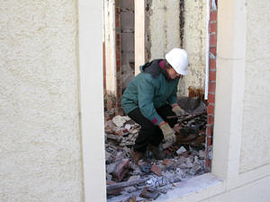 Denise Bourne, digging through the ruins of her office.