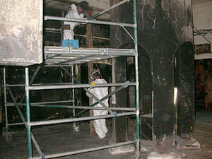 Steel supports being placed under the main beams of the library floor.