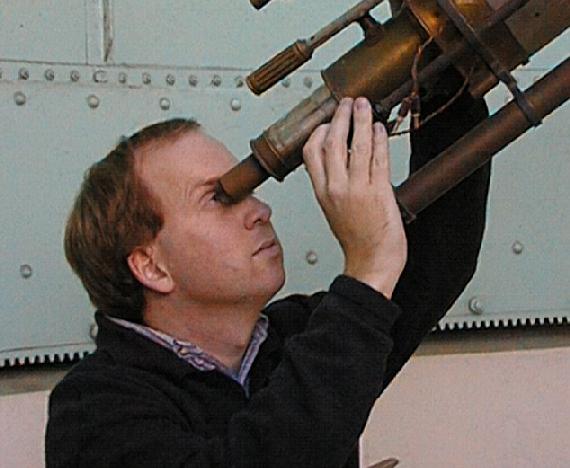 Dr Paul Francis looking
through a small telescope